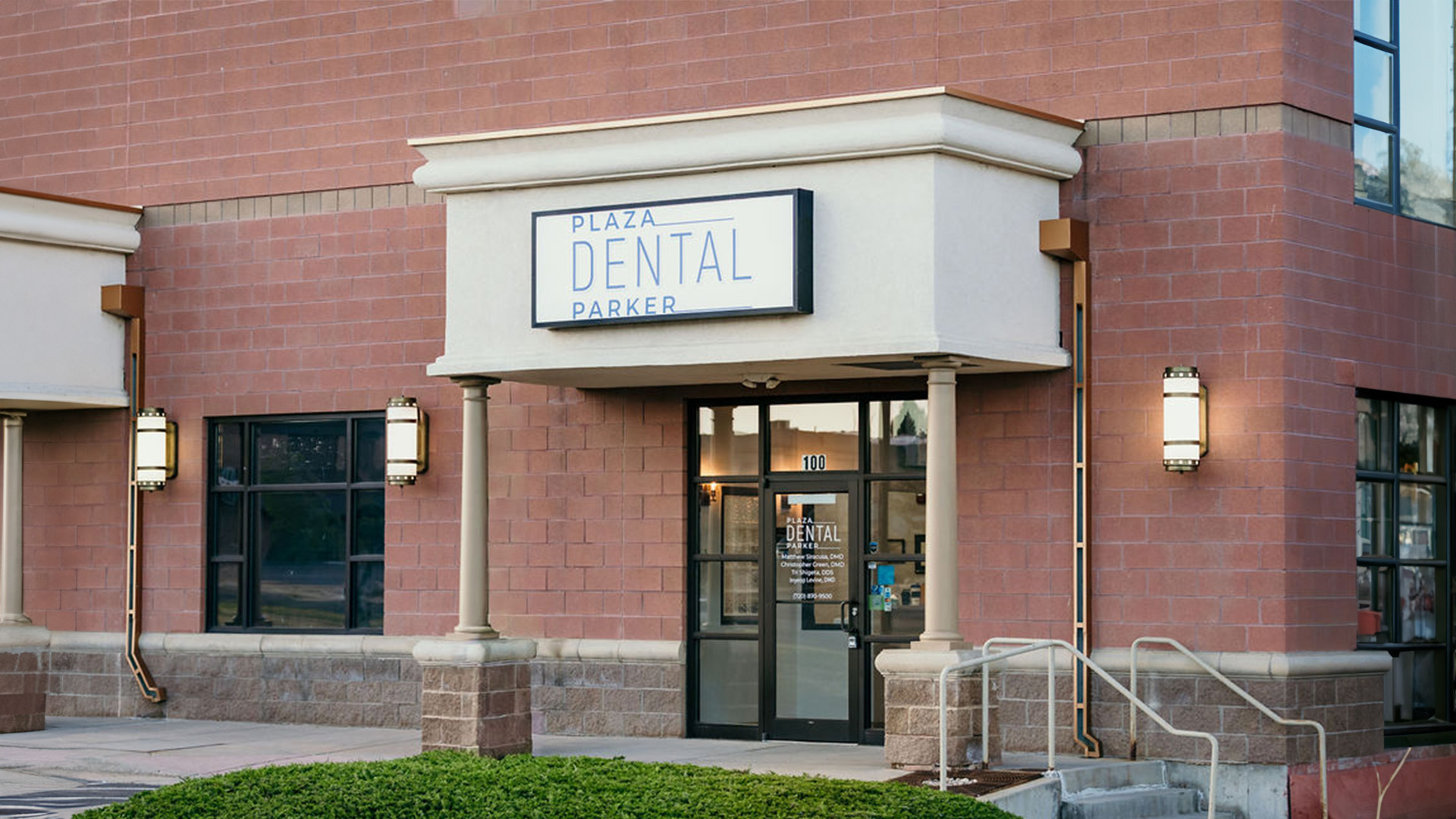 The image shows a building with a sign that reads  Dental  above its entrance, indicating it s a dental clinic.