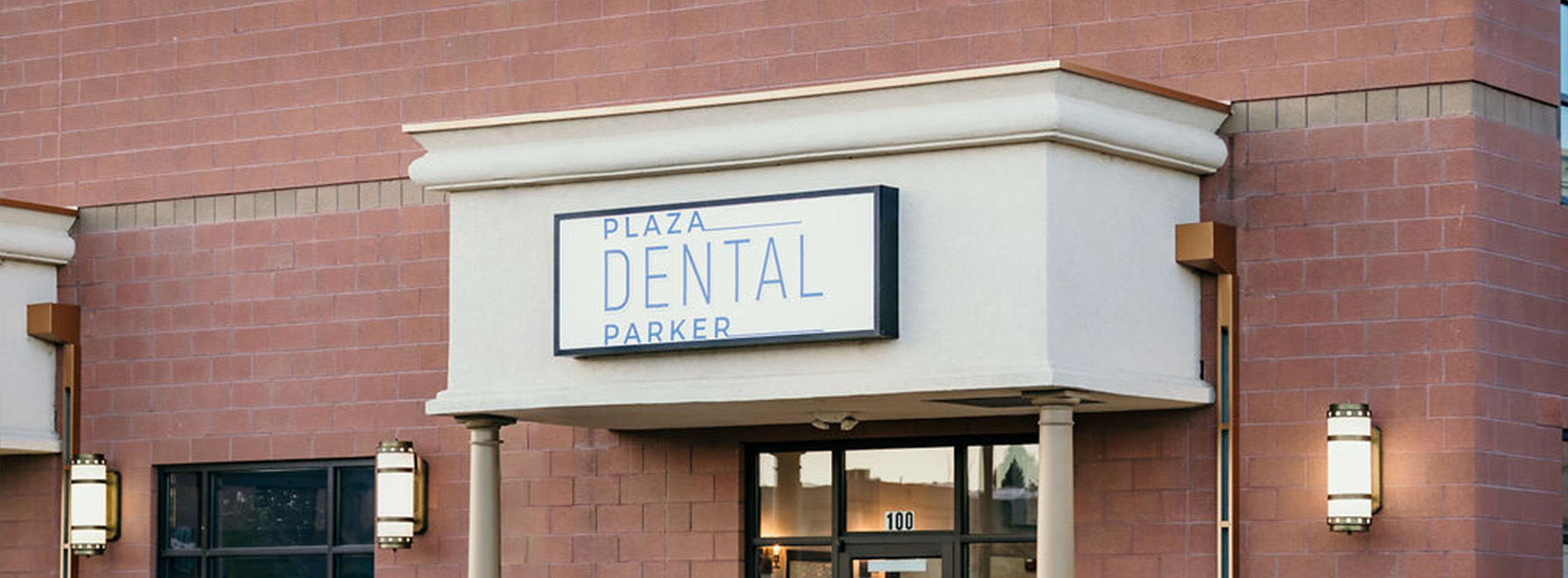 The image shows a building with a sign that reads  Dental Park  on its facade, indicating the presence of a dental facility within.